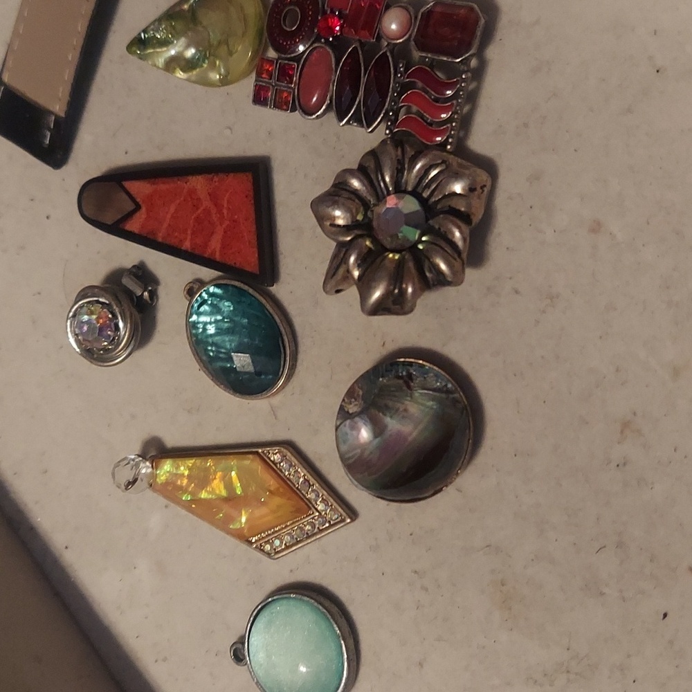 Shiny things my pet crows bring me. Antique jewelery mostly pendants!